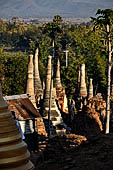 Inle Lake Myanmar. Indein, on the summit of a hill the  Shwe Inn Thein Paya a cluster of hundreds of ancient stupas. Many of them are ruined and overgrown with bushes.